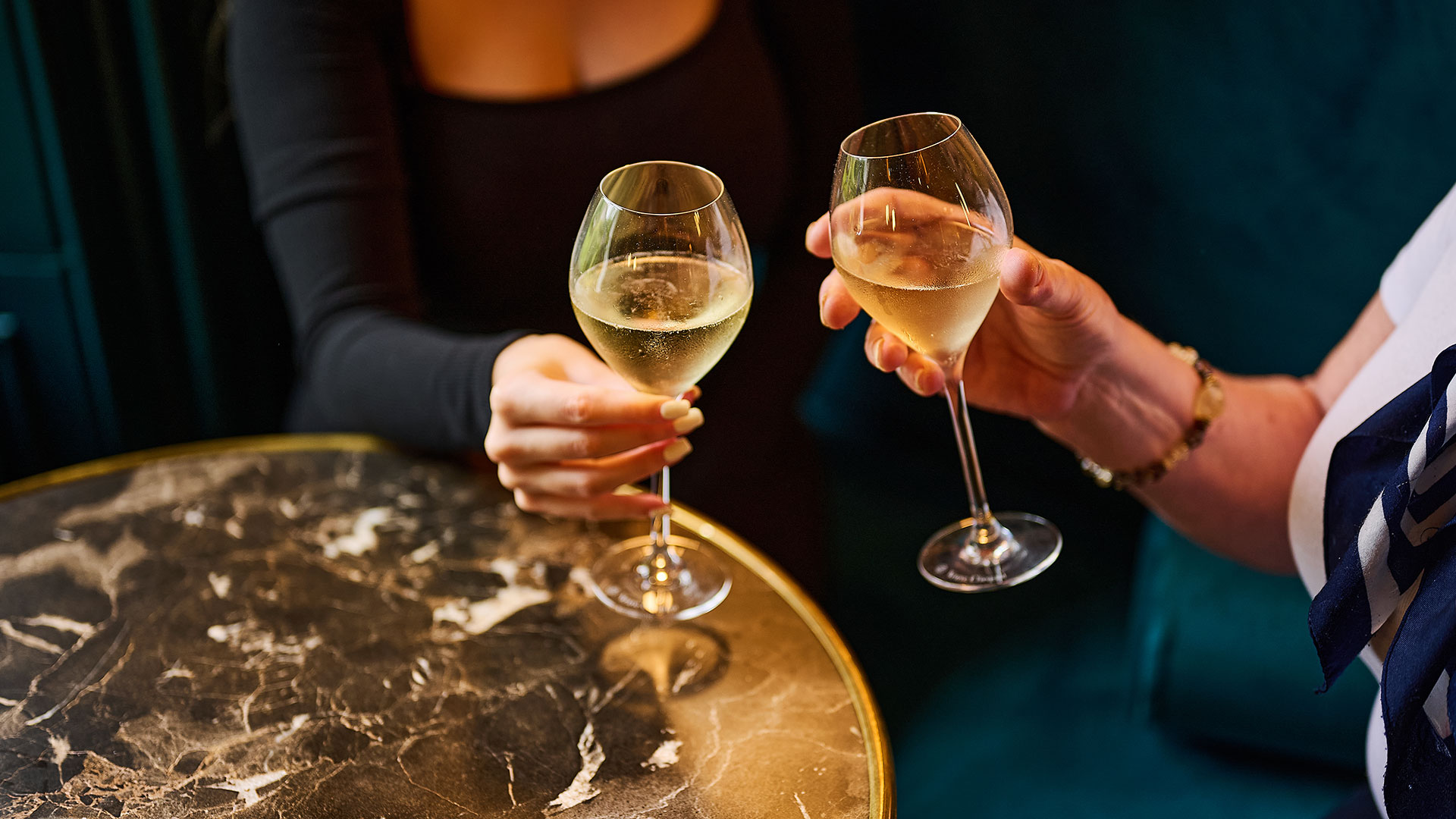 Cozy lounge at Milford Hall Hotel & Spa, Salisbury, featuring comfortable seating and a glass of wine ready for guests to enjoy.