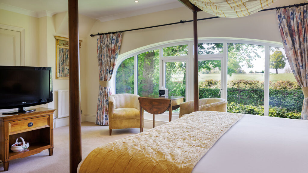 Luxurious four-poster room at Nailcote Hall Hotel, Warwickshire